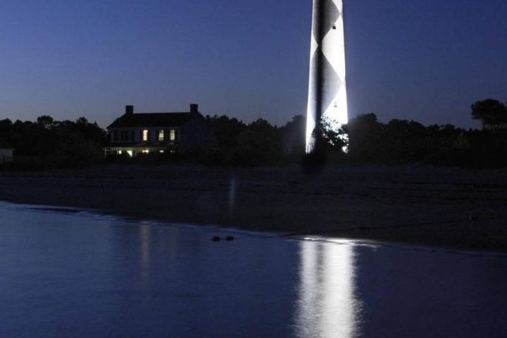 a large clock tower towering over a body of water